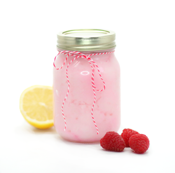 pink body scrub in a mason jar