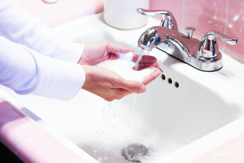 washing hands in a sink